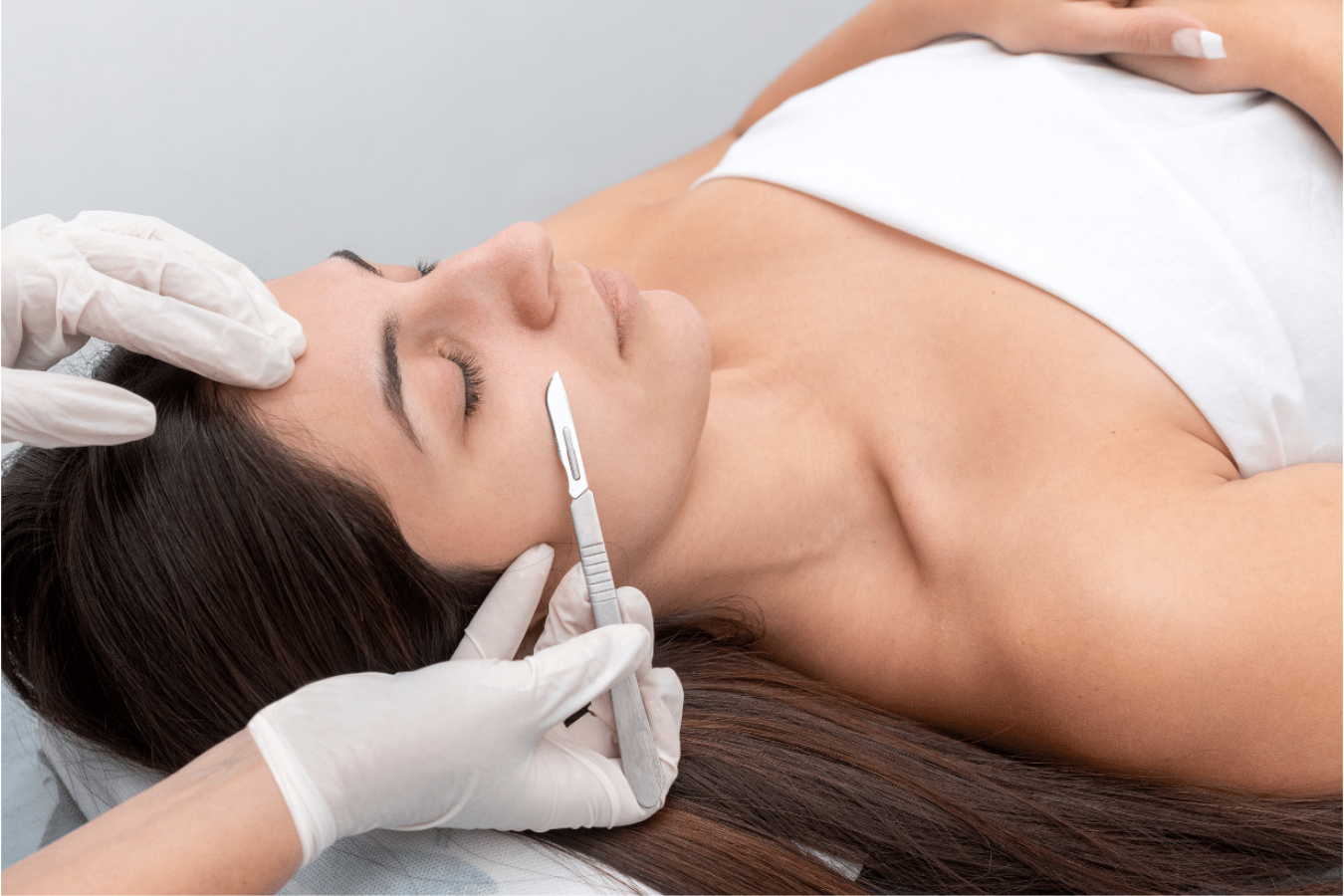 Beautiful woman receiving a dermaplane facial